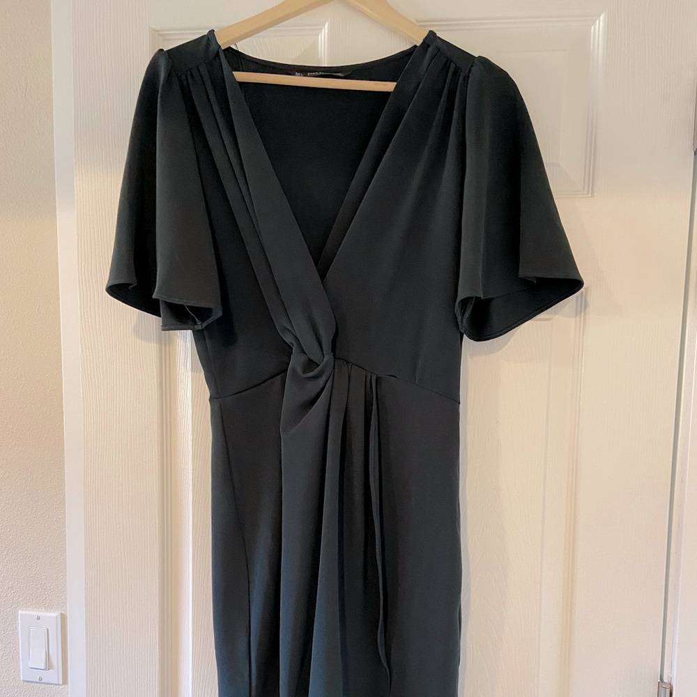 Deep green V neck knotted dress.